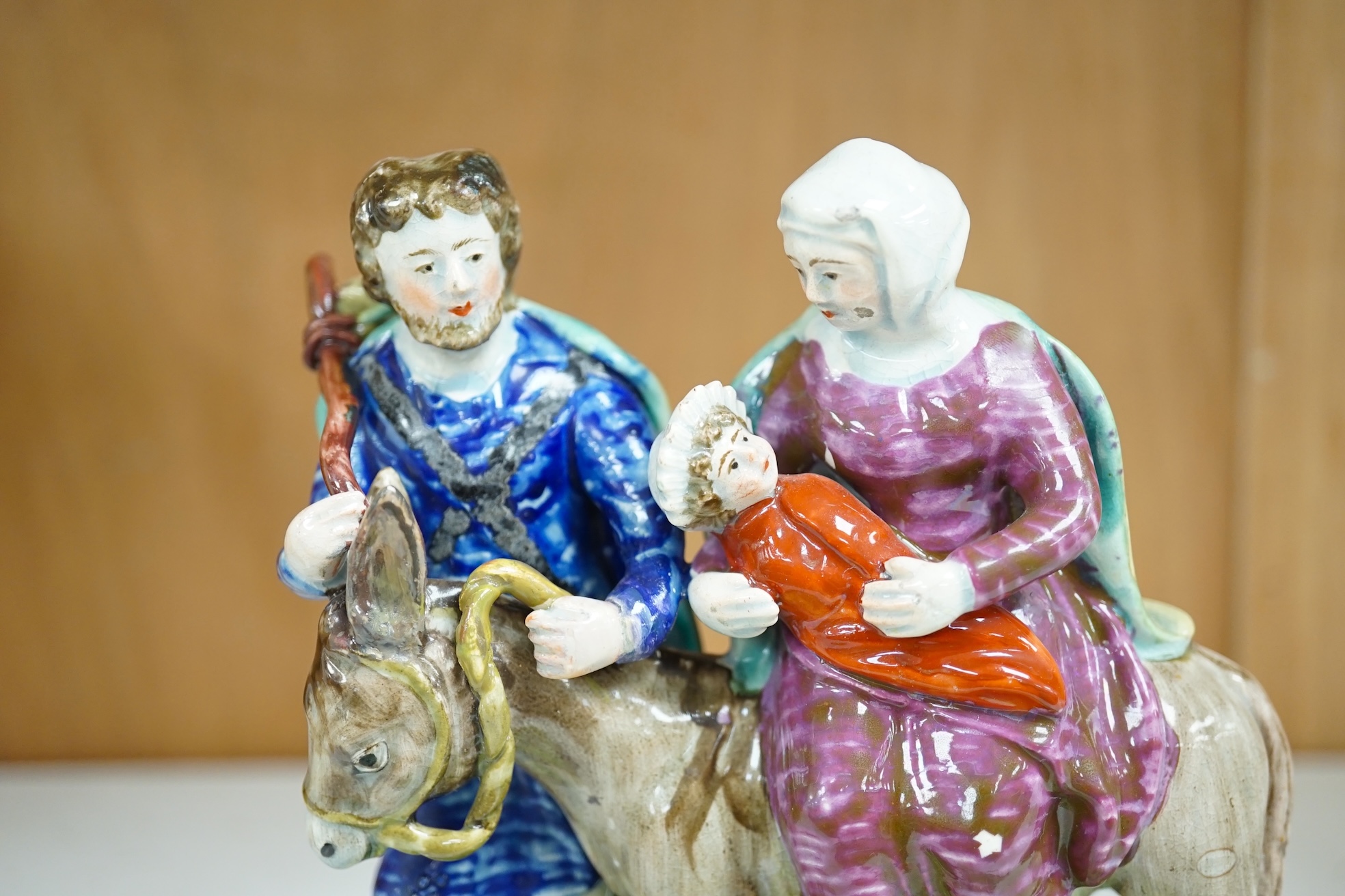 An early 19th century pearlware ‘flight to Egypt’ group, by Walton, 16.5 cm high. Condition - some restoration and bocage lacking